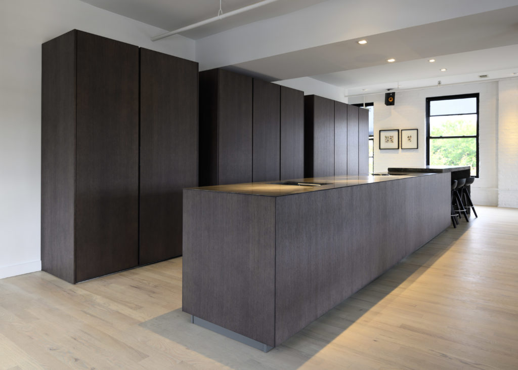 large modern kitchen island, made from durable stone and wood, in the brewery district of Cincinnati.
