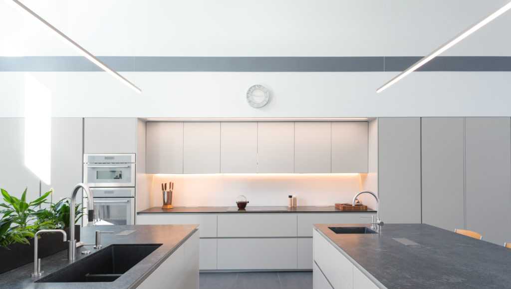 open concept modern kitchen with two kitchen islands and neutral colors