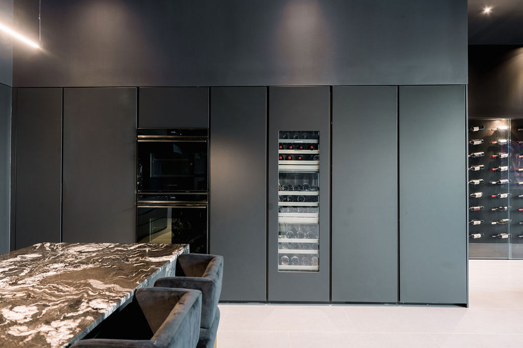 Monolithic, modern custom cabinets with built in wine storage