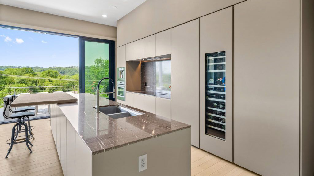 flexible modern kitchen island with seating and stools in cincinnati home