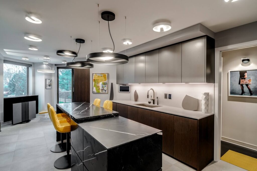 Modern kitchen featuring the Minotticucine Terra 2.0 Isola island, designed by Claudio Silvestrin, showcasing a sleek, minimalist aesthetic with natural materials and elegant lighting.